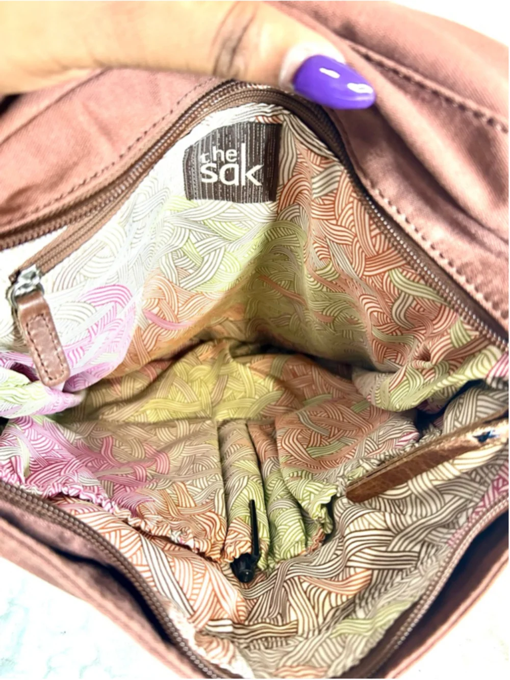 The Sak Ventura Leather Convertible Backpack in a brown, distressed leather